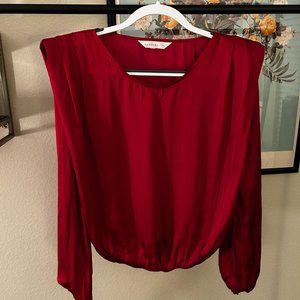 red silk drapey shirt with shoulder-pads
